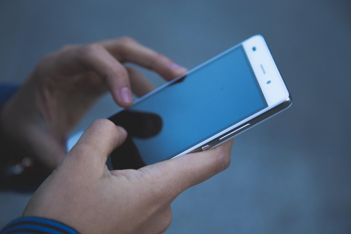 woman using a new smartphone